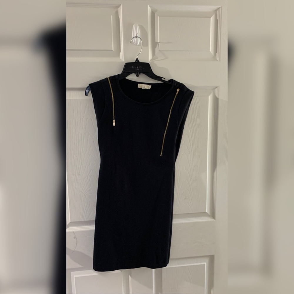 black dress with gold zipper.